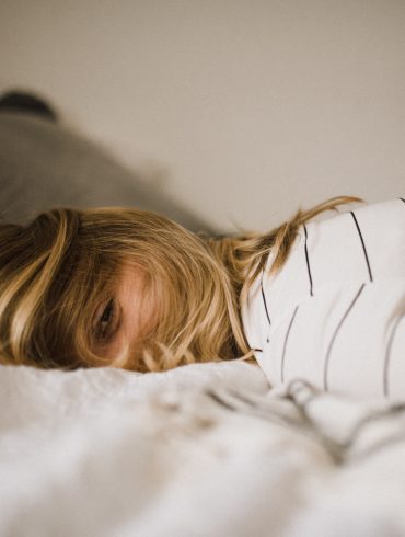 woman lying on bed